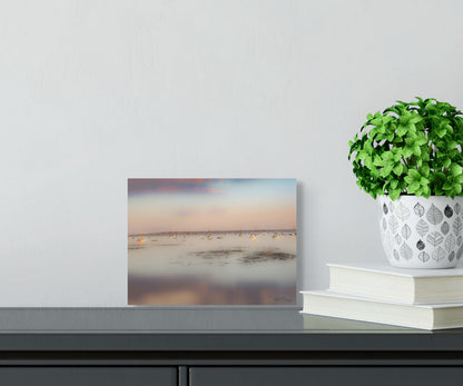A peaceful painting of calm waters in Maine, featuring serene coastal views with gentle ripples and soft, cool colors.