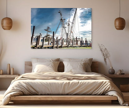 A vibrant painting titled 'Fishing the N.C. Coast,' showcasing a fishing boat along the North Carolina coastline with clear waters and coastal scenery.