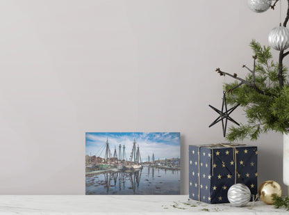 A detailed painting titled 'Ships of Canton,' showcasing traditional ships in a bustling harbor scene, reflecting maritime history and cultural heritage.